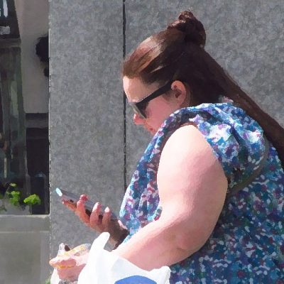 Morbidly obese woman on the phone